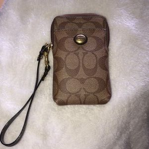 Coach wristlet, worn once. Brown/tanned